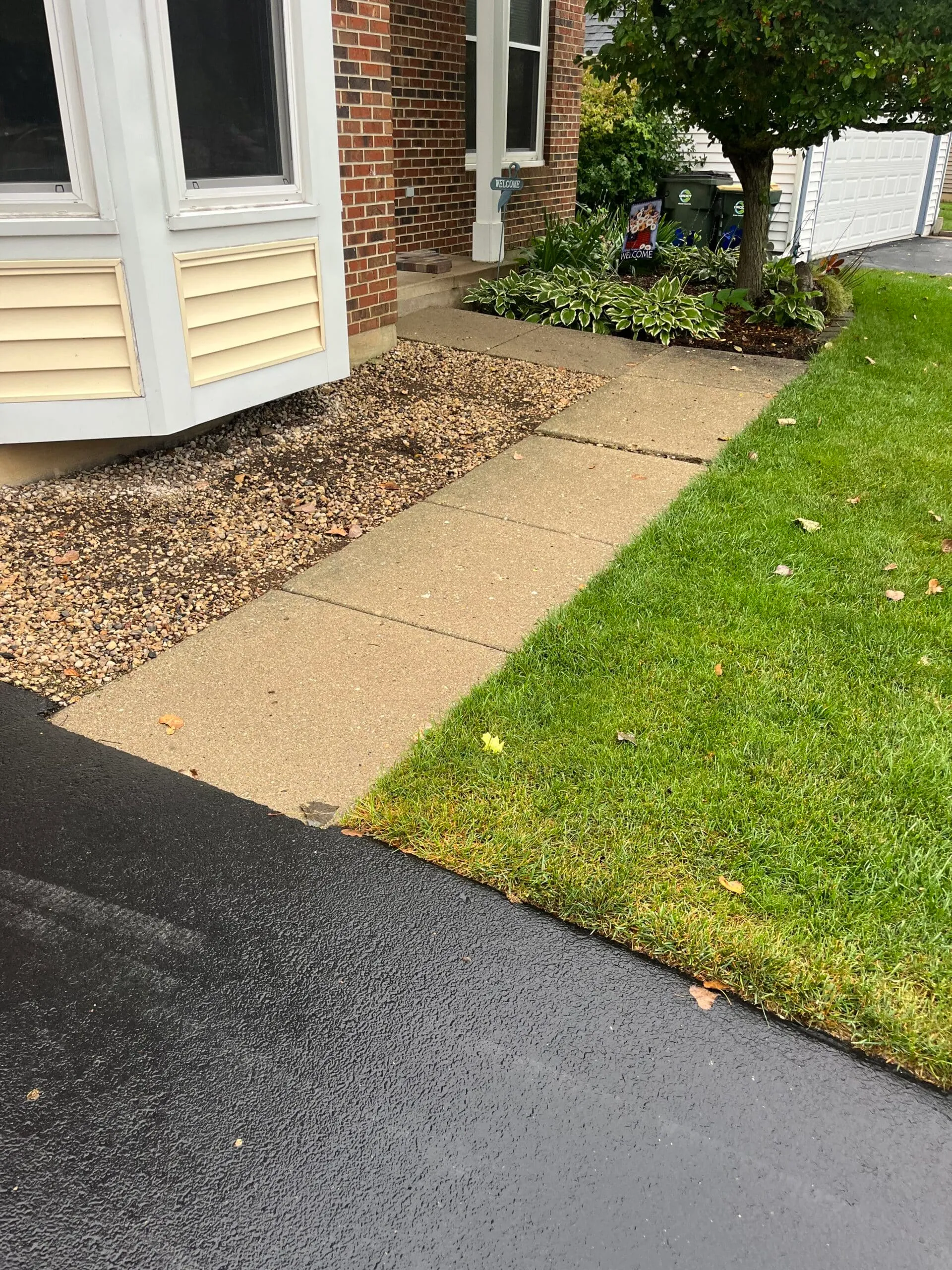 Paver walkway along front lawn