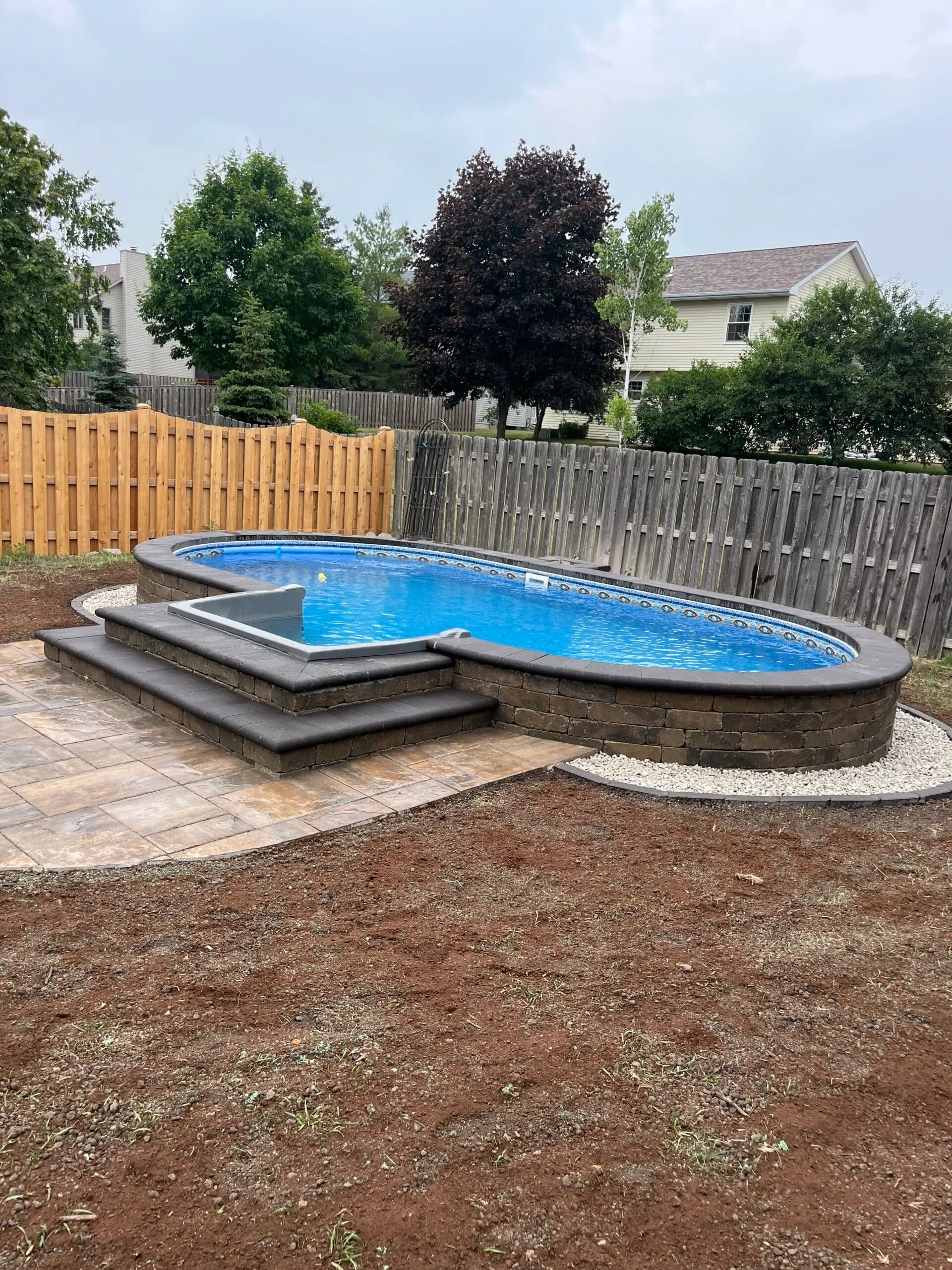 Backyard pool with paver coping and deck