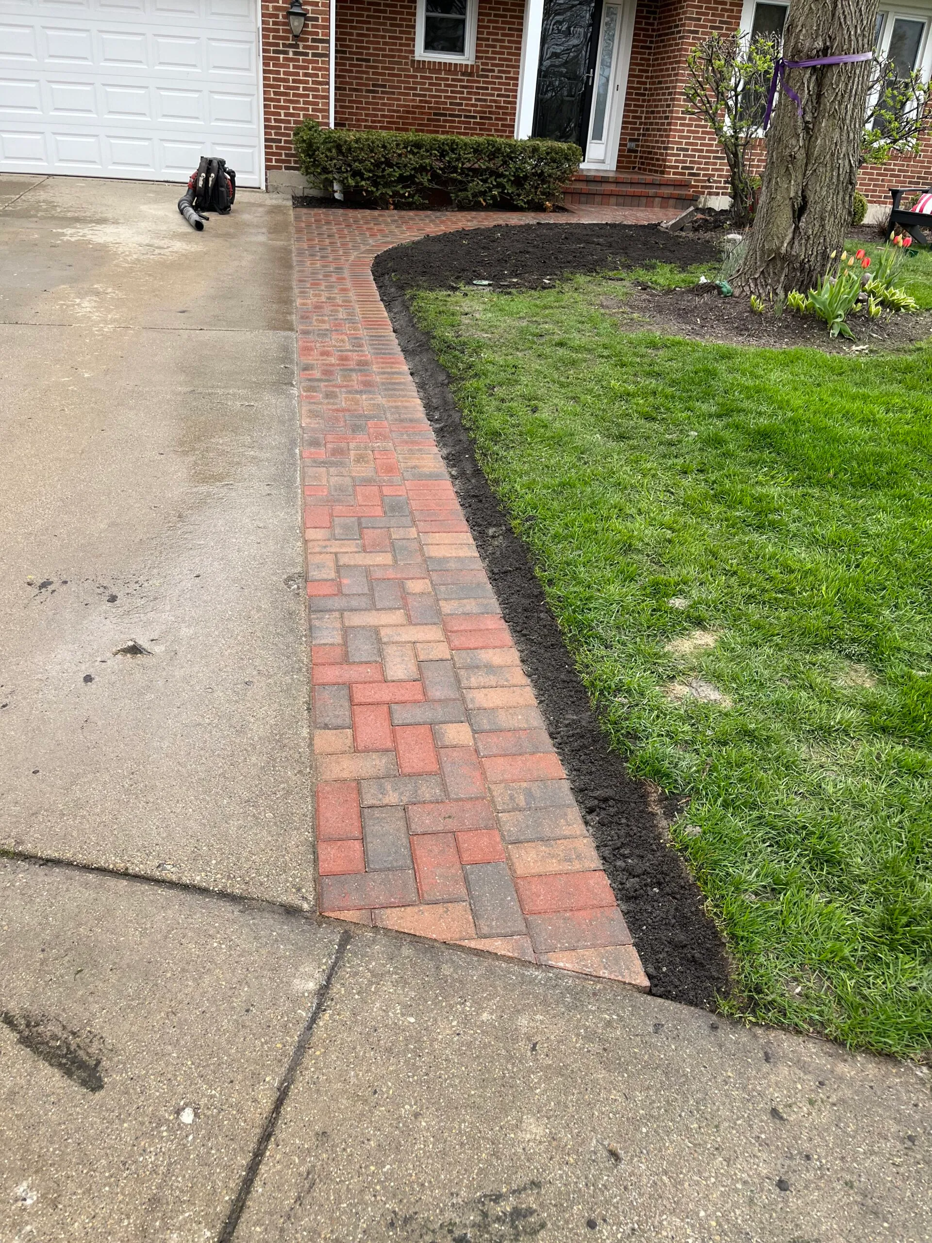 Red clay paver edging along walkway